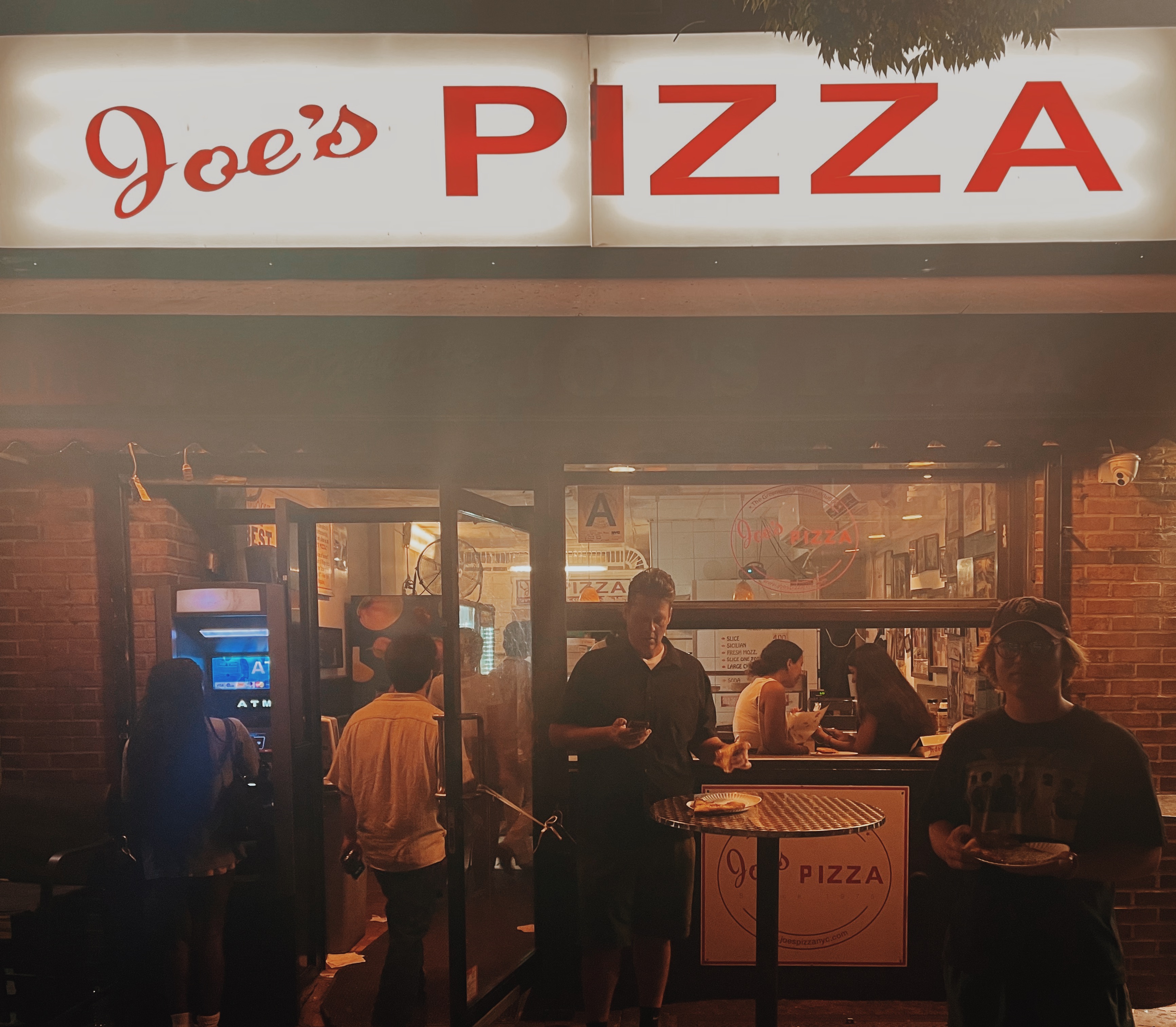 Storefront of Joe’s Pizza